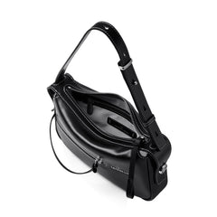 Amazing Song black leather shoulder bag with zipper and white stitching on white background