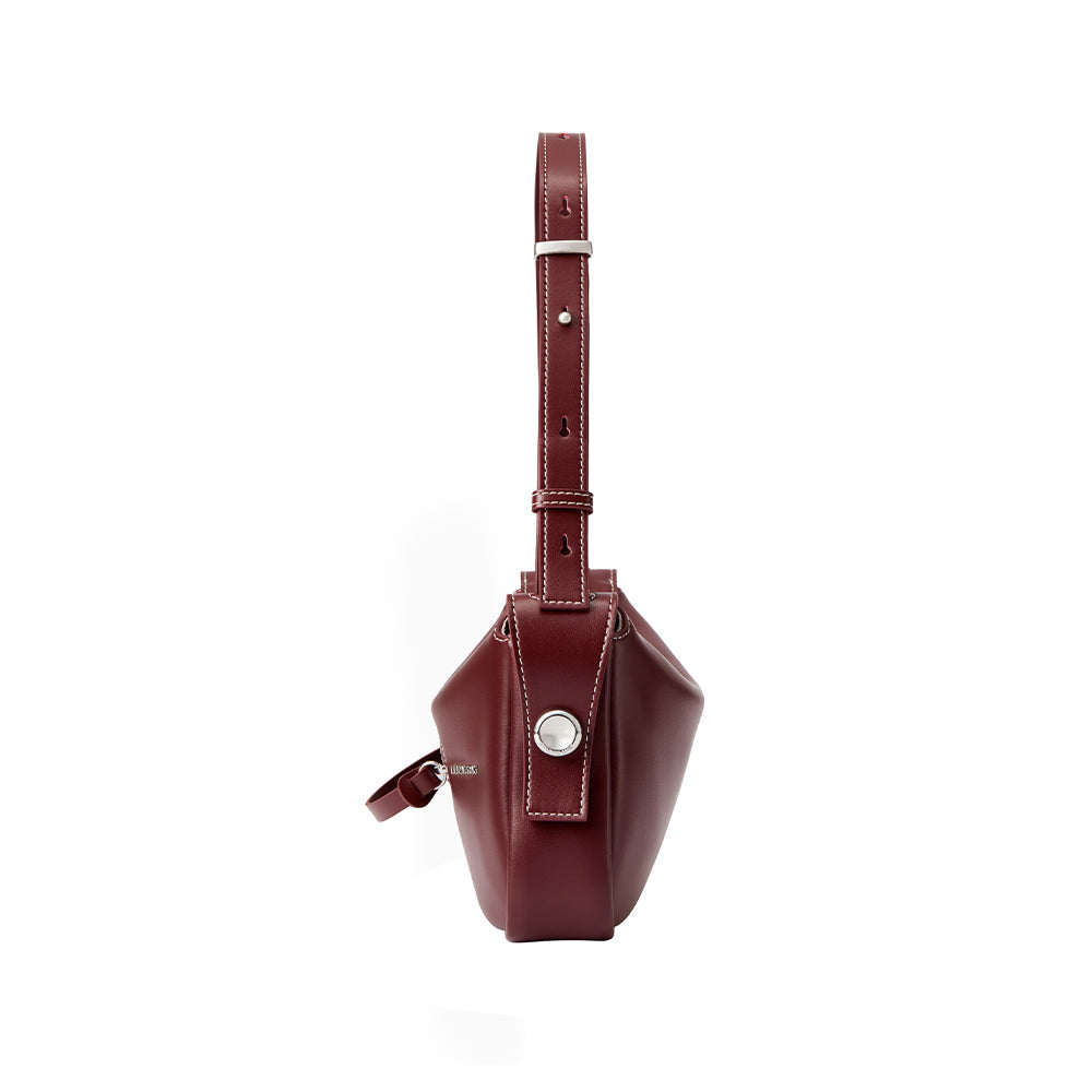 Side view of a burgundy leather handbag with adjustable strap, Amazing Song official website