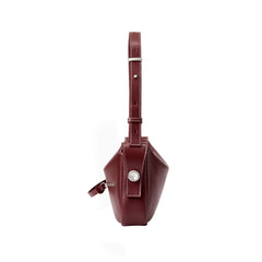 Side view of a burgundy leather handbag with adjustable strap, Amazing Song official website