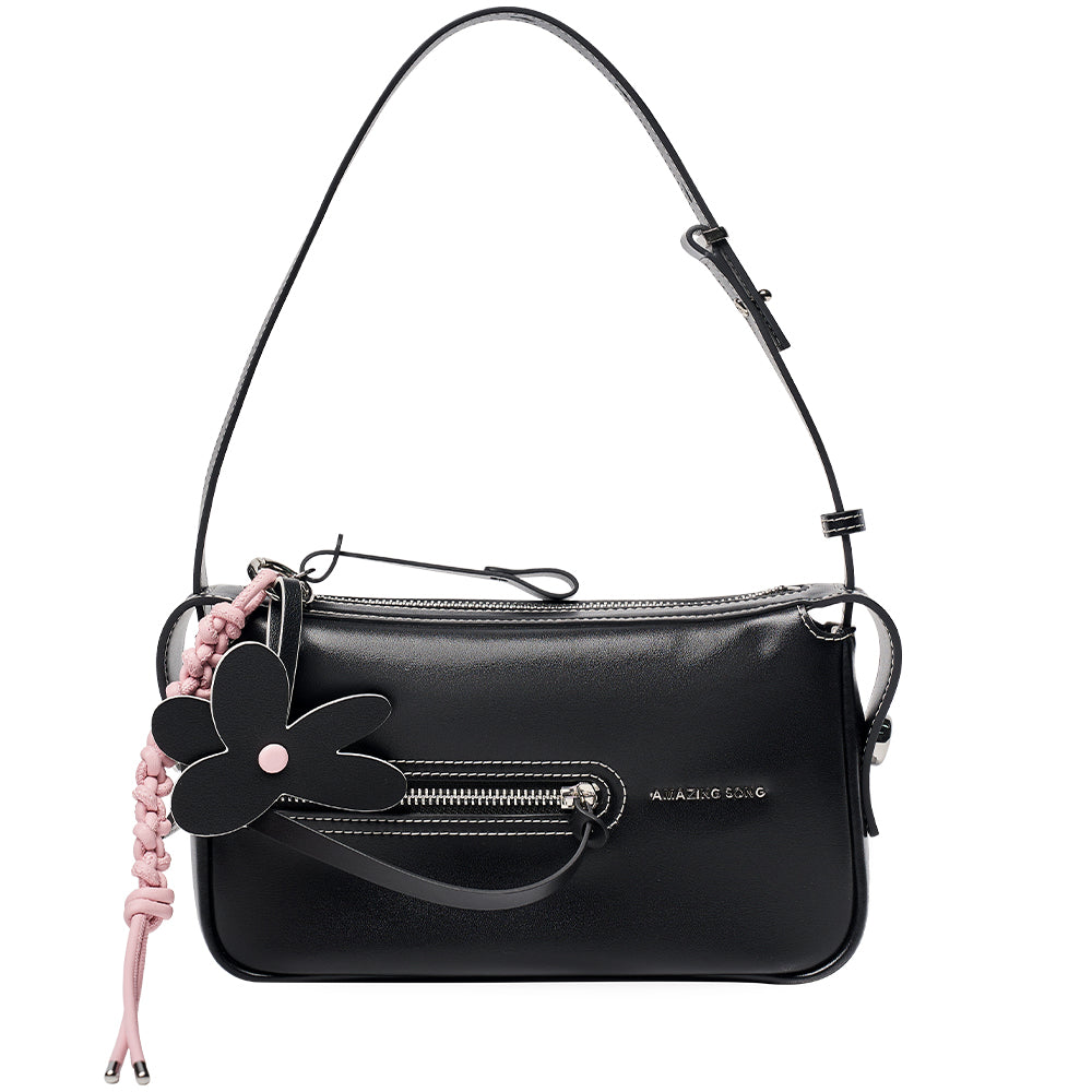 Amazing Song black shoulder bag with flower charm, front zipper, and pink braid detail