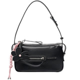 Amazing Song black shoulder bag with flower charm, front zipper, and pink braid detail