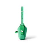 Side view of green suede crossbody bag with adjustable strap on white background