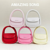 Amazing Song handbags in red, pink, white, and yellow displayed on soft beige background