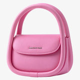 Amazing Song pink handbag with unique double handle design on white background