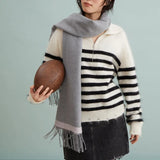 Woman in striped sweater and grey scarf holding rugby ball, Amazing Song official website