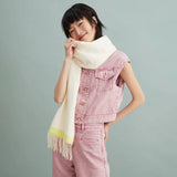 Smiling woman in sleeveless pink denim jacket and pants, wearing a cream scarf, Amazing Song