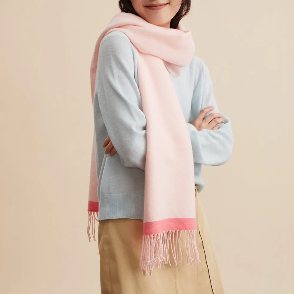 Woman wearing a pastel pink scarf, light blue sweater, and tan skirt from Amazing Song