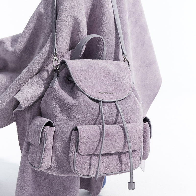 Light purple suede backpack with front pockets and silver accents, Amazing Song official website
