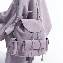 Light purple suede backpack with front pockets and silver accents, Amazing Song official website