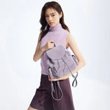 Woman in sleeveless lavender top holding a light purple backpack, Amazing Song style