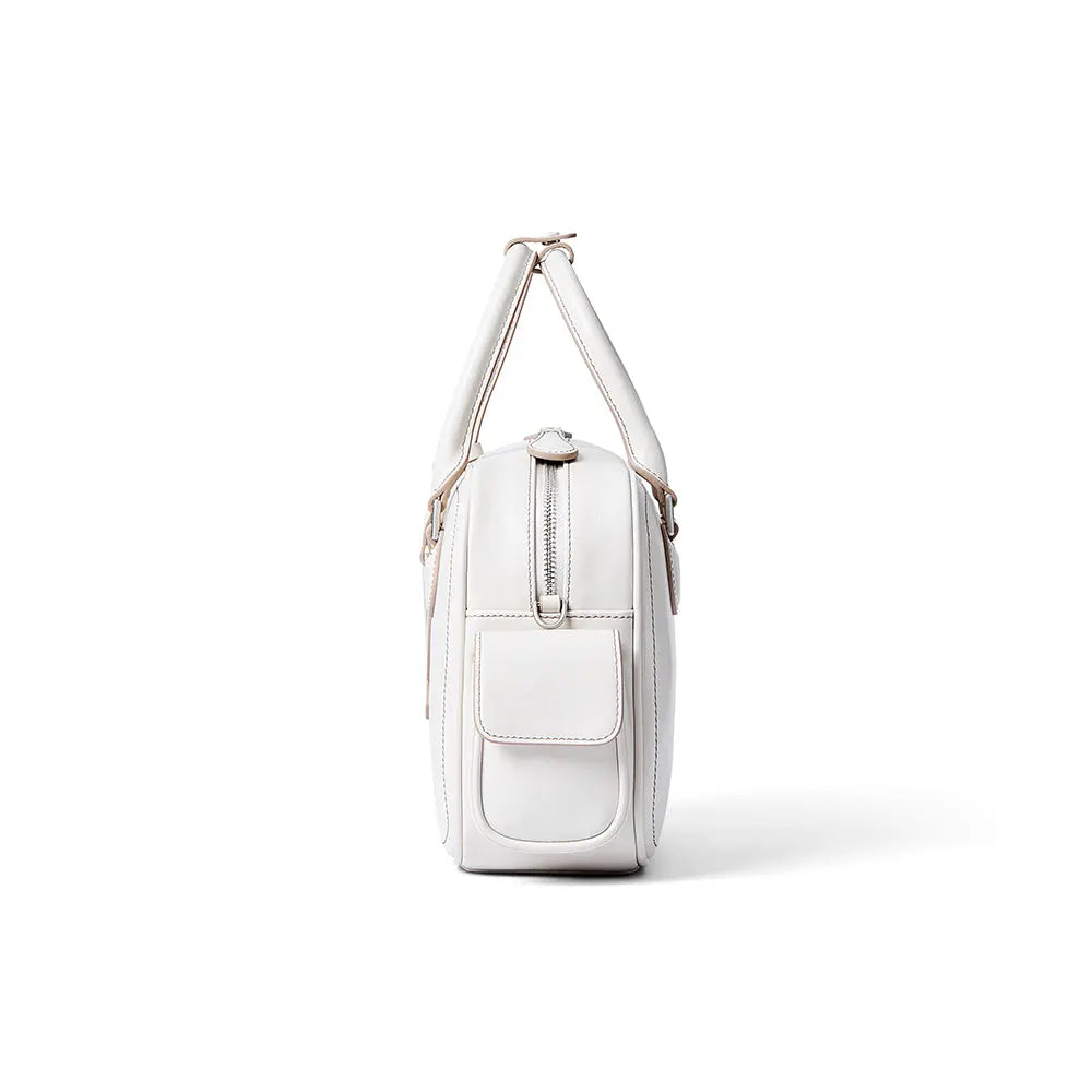 White leather handbag side view with zipper and front pocket, Amazing Song official site