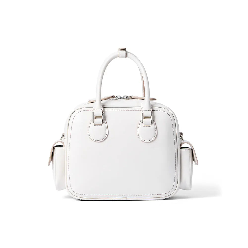 White leather handbag with top handles and side pockets on plain background, Amazing Song