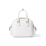 White leather handbag with top handles and side pockets on plain background, Amazing Song