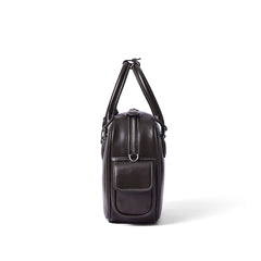 Side view of a dark brown leather handbag with white stitching and pocket, Amazing Song