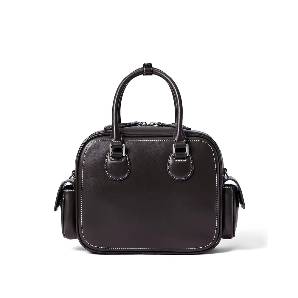 Black leather handbag with dual handles and side pockets on white background, Amazing Song