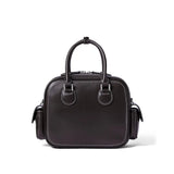 Black leather handbag with dual handles and side pockets on white background, Amazing Song