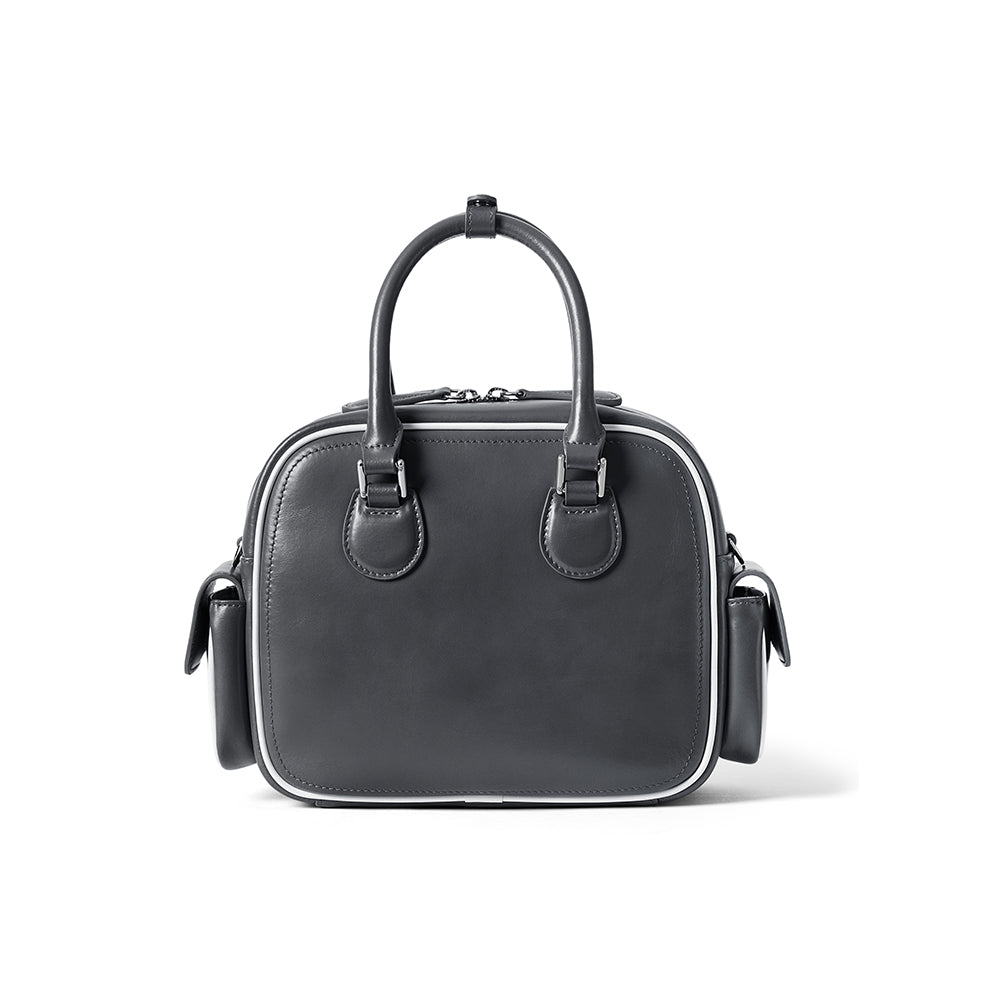 Black leather handbag with top handles, side pockets, and white trim, Amazing Song brand