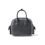 Black leather handbag with top handles, side pockets, and white trim, Amazing Song brand