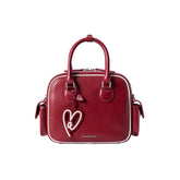 Amazing Song red leather handbag with heart-shaped tag and double handles