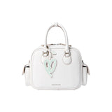 White Amazing Song handbag with top handles and pastel heart charm, front view