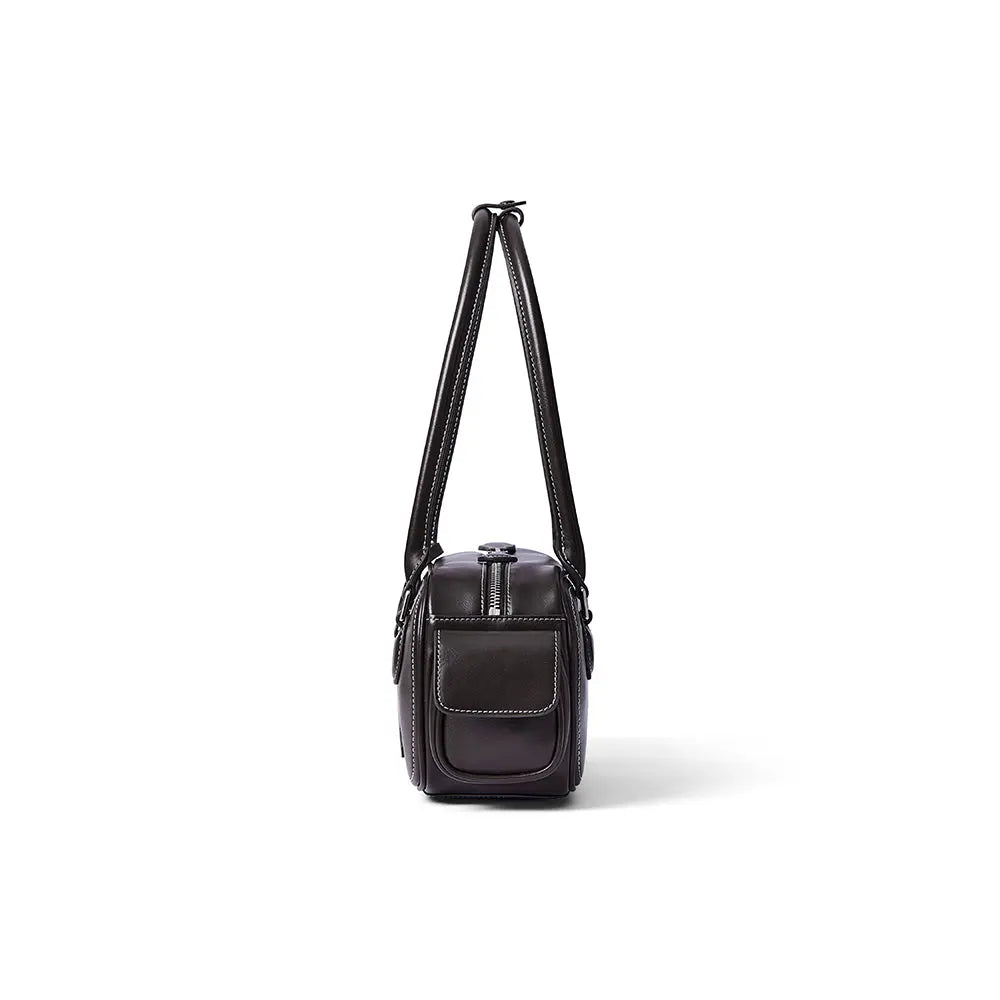 Side view of a black leather handbag with white stitching, Amazing Song official website