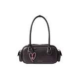 Amazing Song black handbag with double straps and pink heart accent on white background