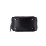 Bottom view of black leather Amazing Song bag with silver metal feet and zipper detail