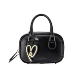 Amazing Song black handbag with heart charm, white stitching, and logo on front