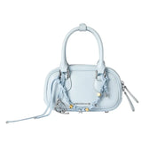 Light blue Amazing Song handbag with double handles, heart charm, and decorative accents.
