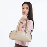 Woman holding beige Amazing Song handbag, fashion accessory, white background