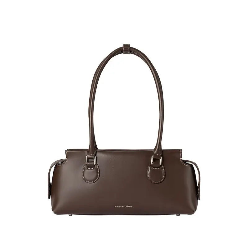 Amazing Song brown leather handbag with dual handles on white background