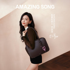 Woman holding brown Amazing Song handbag, smiling in modern setting, official website promo