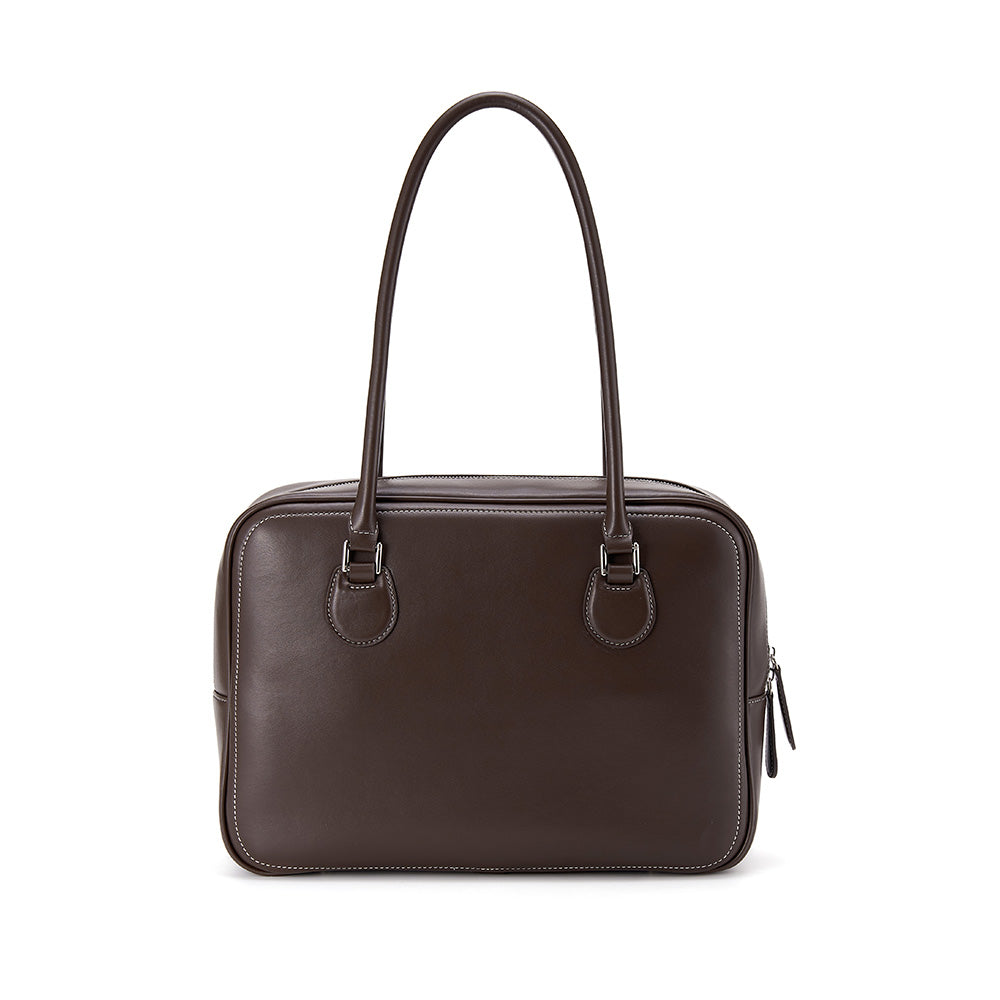 Dark brown leather handbag with double handles, featured on Amazing Song official website