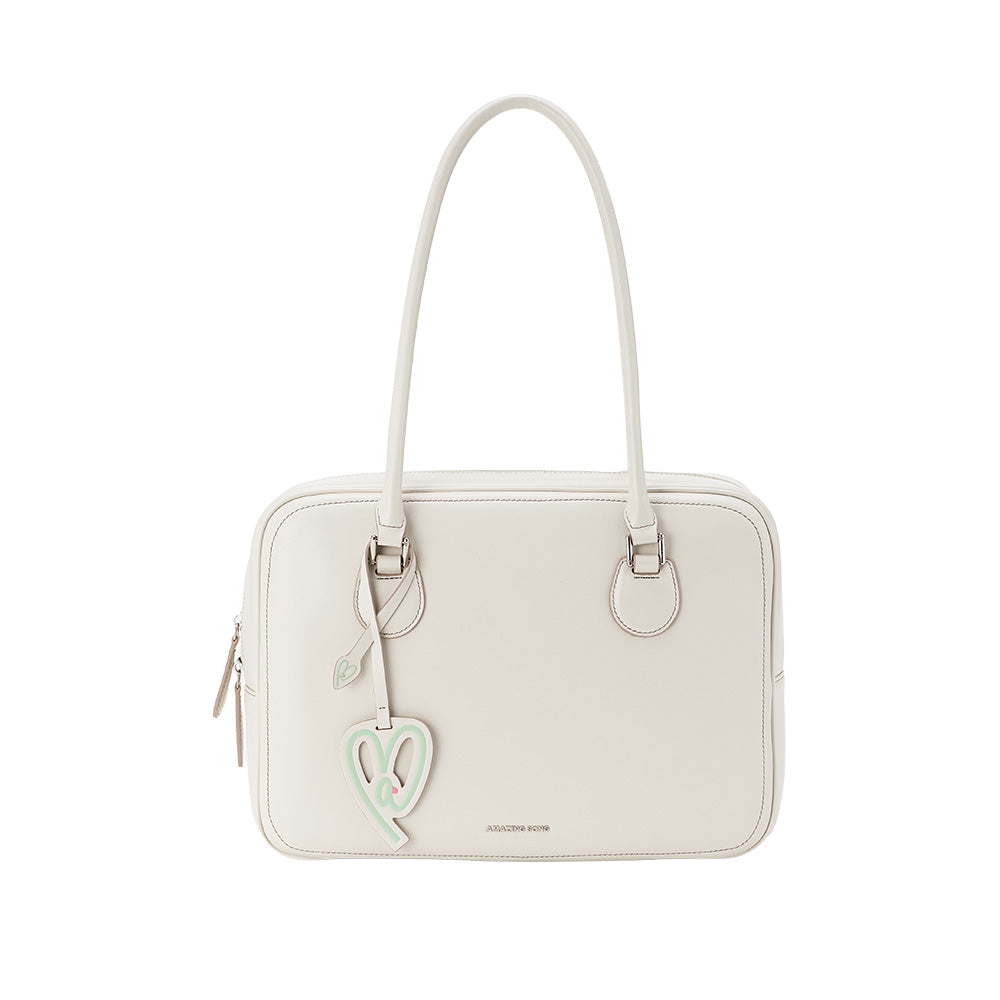 Elegant cream handbag with heart-shaped tag, Amazing Song brand, official website product