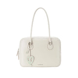 Elegant cream handbag with heart-shaped tag, Amazing Song brand, official website product