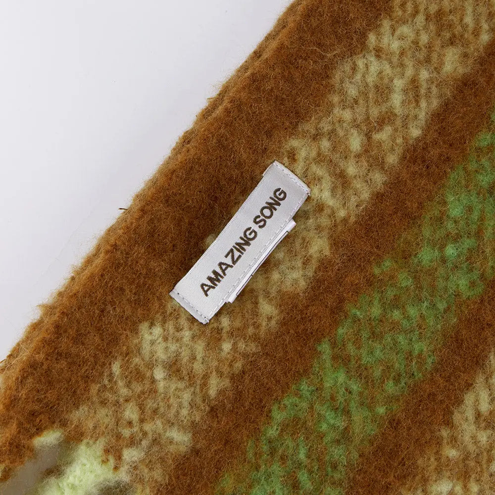 Amazing Song label on soft brown and green textured fabric