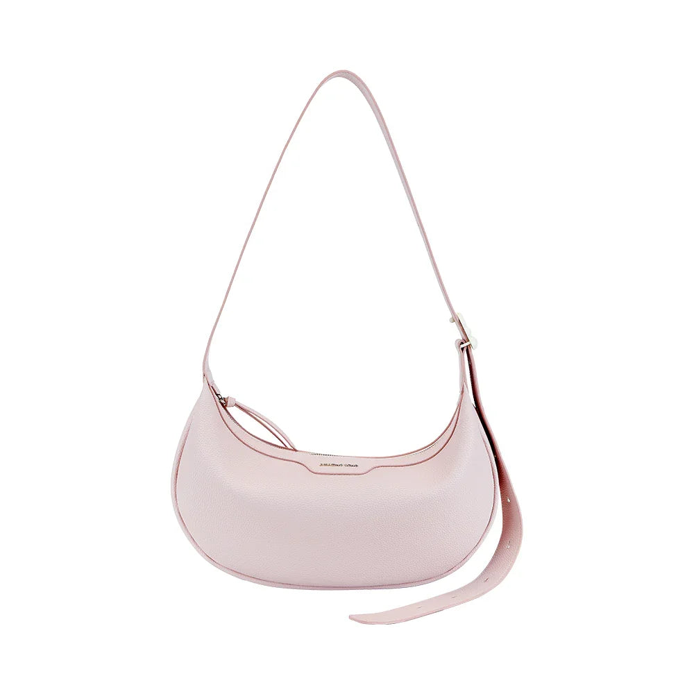 Light pink leather shoulder bag with adjustable strap on white background