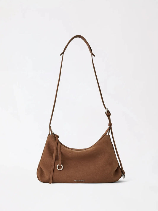small donut-shaped top-grain cowhide leather hobo bag in a soft pastel tone
