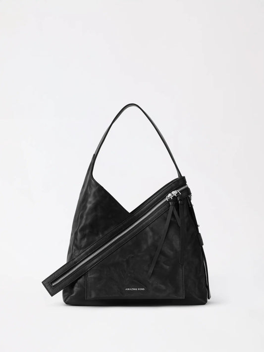 Cheese roll shoulder bag in caramel leather with gold tone clasp and top handle