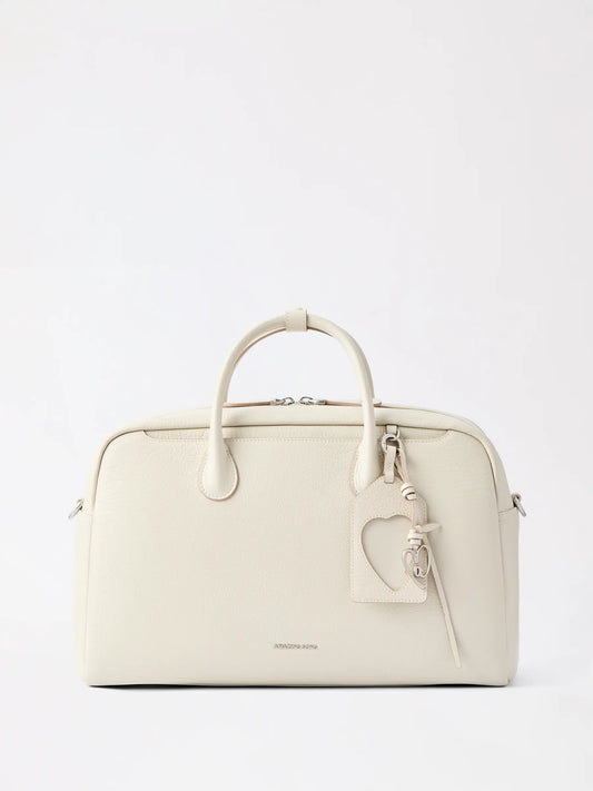 A spacious leather travel Boston bag in warm tan for weekend trips