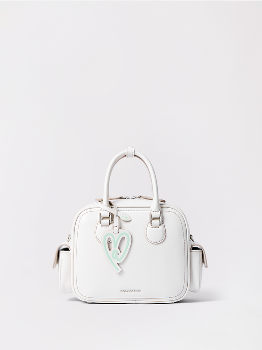 Medium toast-shaped leather bag standing upright with a shoulder strap and roomy open top