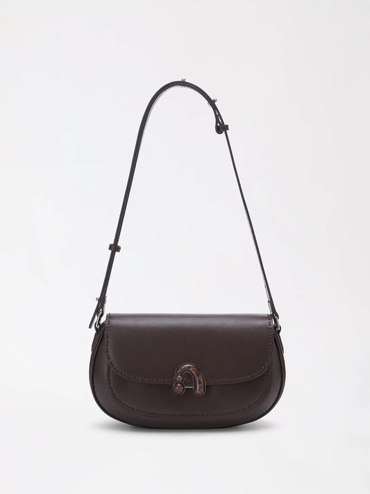 Large chestnut top-grain leather bag with a soft rounded silhouette and minimal hardware