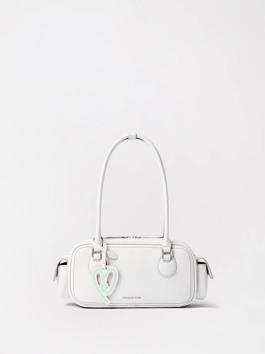 A long tan leather baguette bag shaped like a fresh loaf of bread
