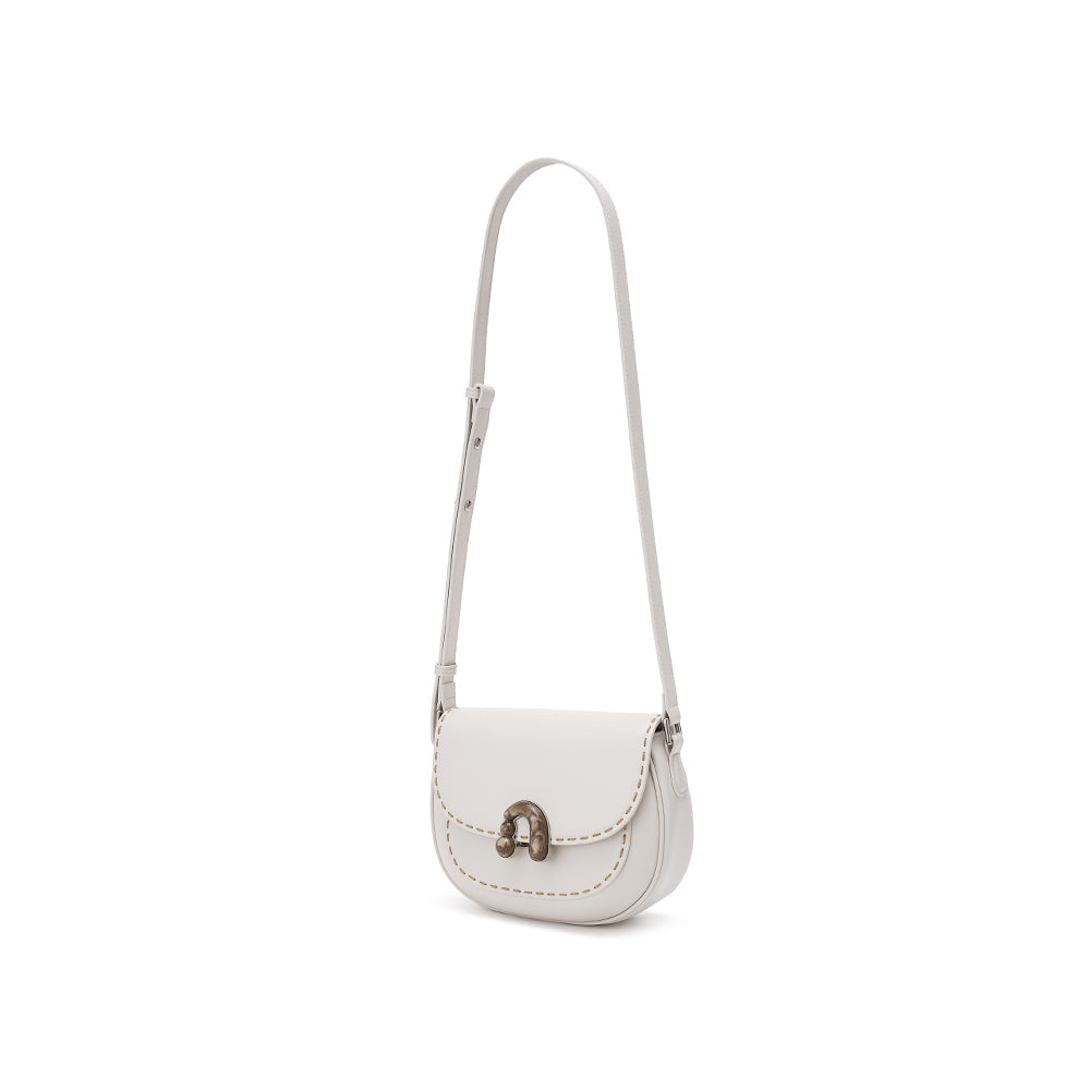White leather crossbody bag with adjustable strap and metal clasp, Amazing Song fashion accessory