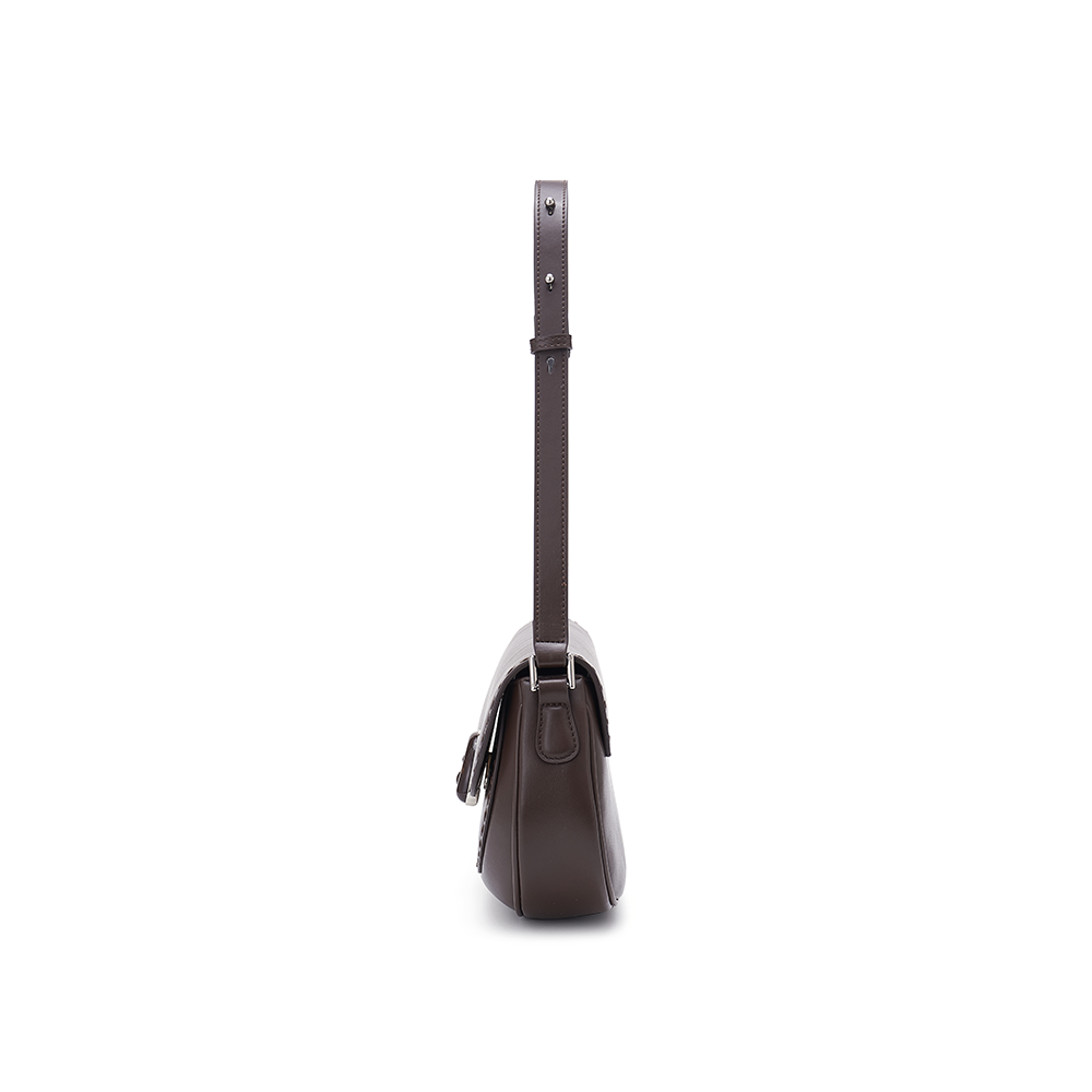 Side view of a brown leather handbag with adjustable strap on white background, Amazing Song
