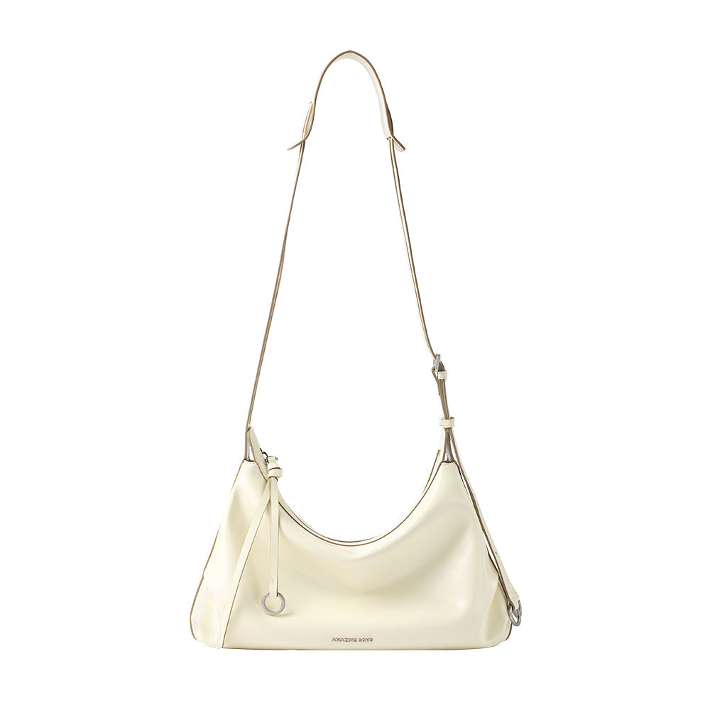 Amazing Song cream shoulder bag with adjustable strap against white background