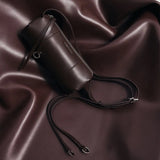 Dark brown leather cylinder bag with strap on matching brown fabric, Amazing Song accessories