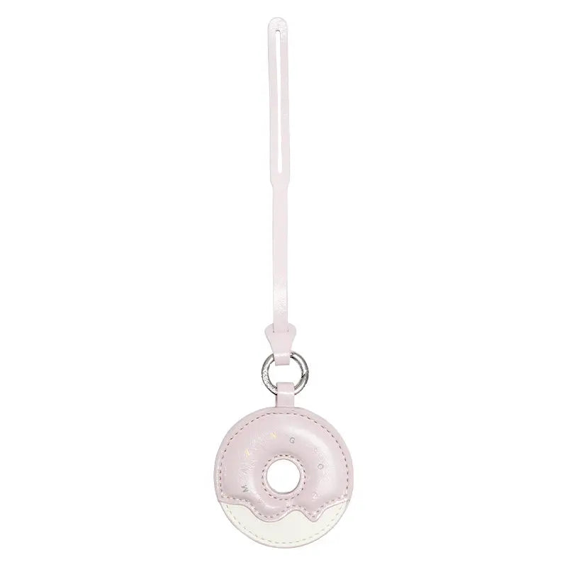 Pink donut-shaped keychain accessory with strap, Amazing Song website product
