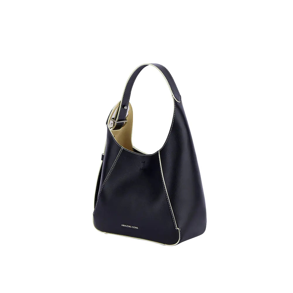 Amazing Song black leather handbag with white stitching and a top handle on white background