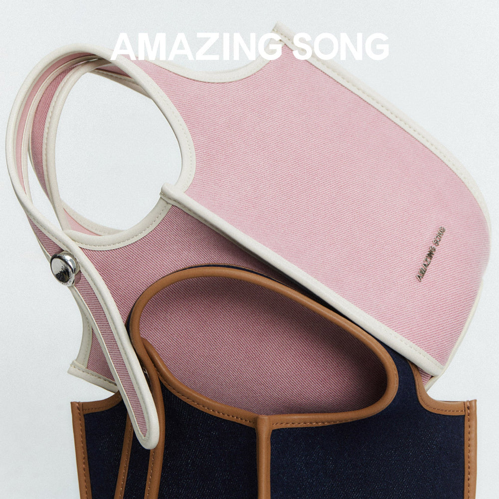 Amazing Song pink and navy designer tote bags stacked with logo, official website style